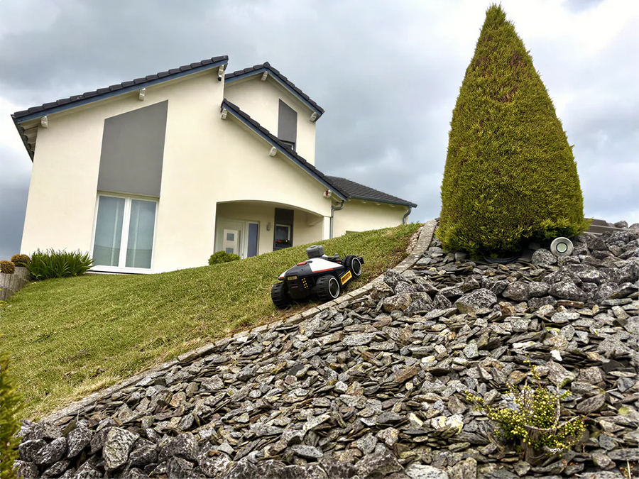 MAMMOTION robotic mower maintaining a family lawn